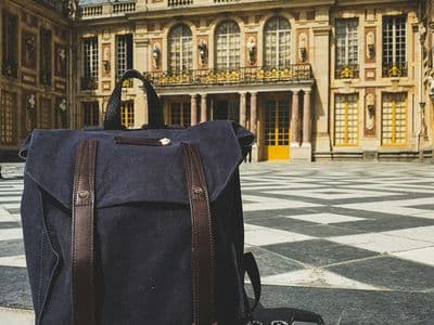 black DLSR camera and bag at Versailles